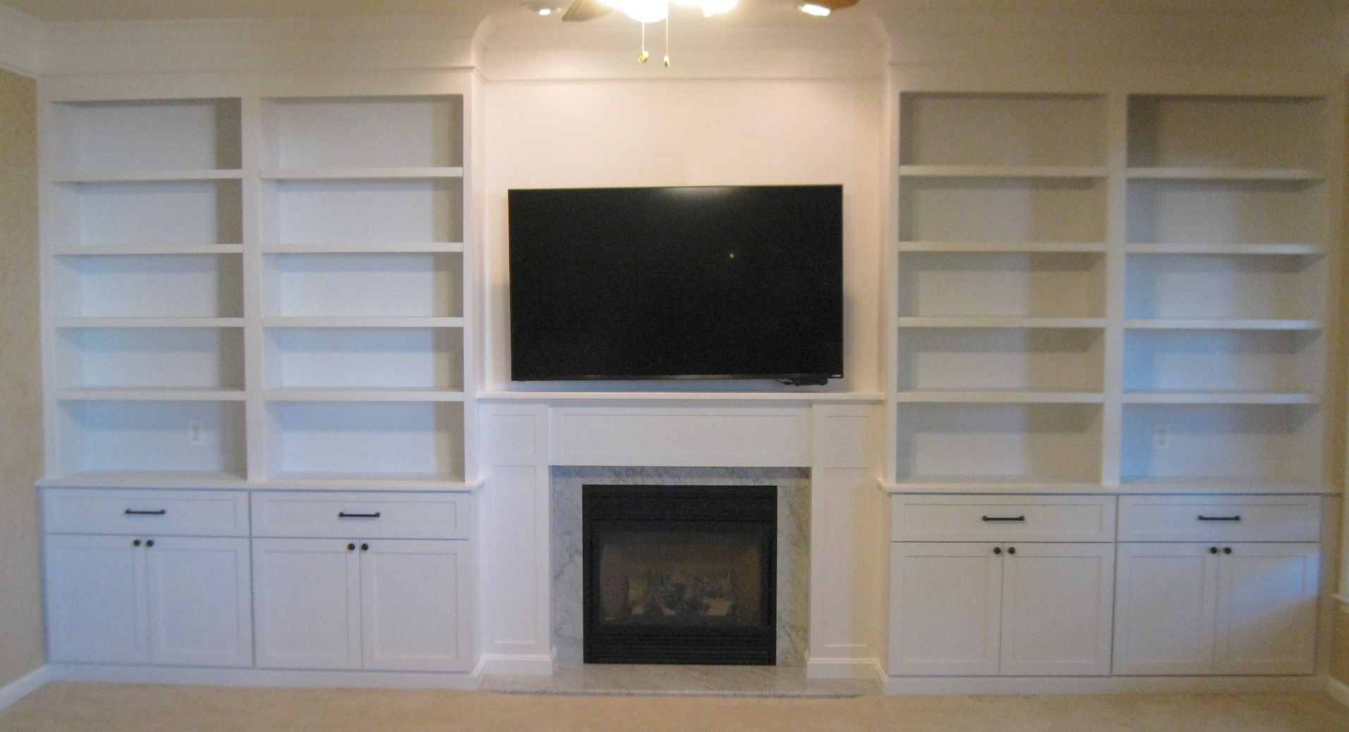 Finished Shelving with Storage and Fireplace mantel